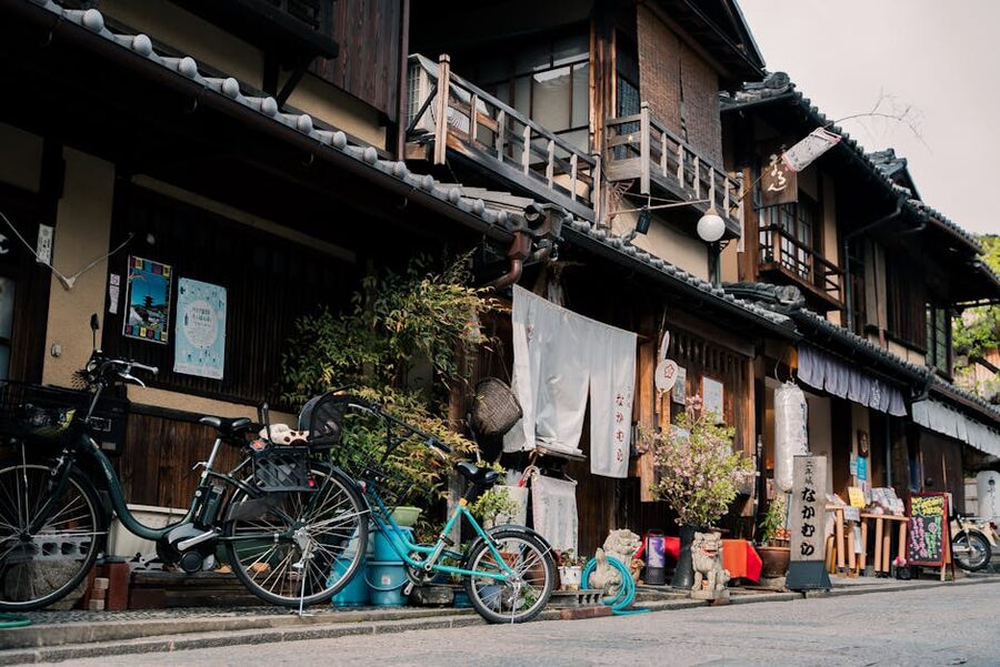 Kyoto street with wooden machiya houses and paper lanterns