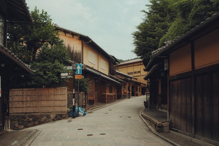 Quiet residential side street in Kyoto with traditional houses