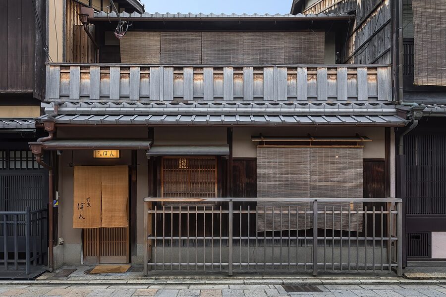 Machiya facade with sudare bamboo blinds and wooden balustrades, Gion, Kyoto