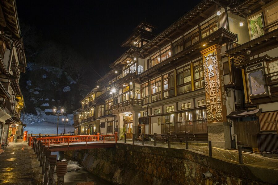 Hot spring ryokan town lit at night