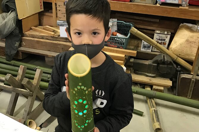 Bamboo LED Lantern Making Experience in Kyoto Arashiyama - Drilling a lantern by hand