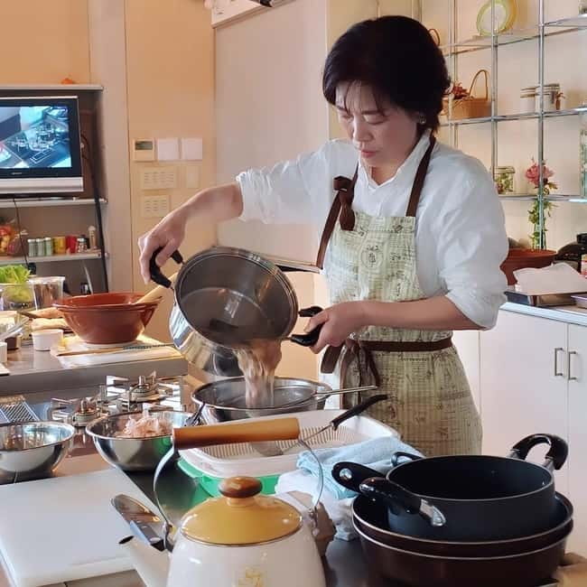 Experience Authentic Japanese Home Cooking in Kyoto - Cutting seasonal vegetables for a simmered dish