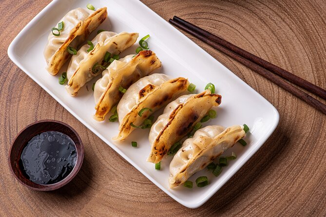 Gyoza Cooking Class in Kyoto: Traditional Japanese Dumplings - Cooking the dumplings with the professional machine
