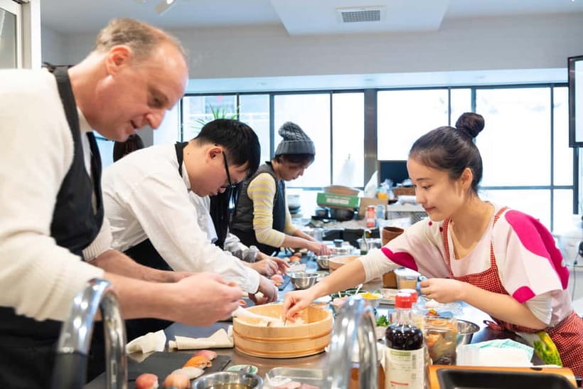 Kyoto: Enjoy Sushi & Market Tour! Best for Family & Couple! - Nishiki Market: fish cutting before the cooking begins