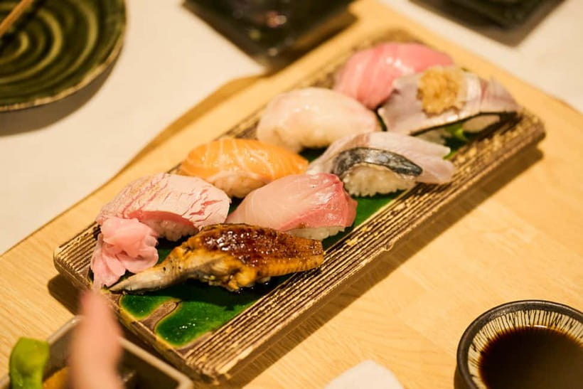 Kyoto: Guided Food Tour with 12 Dishes & 3 Drinks - Walking through Gion between bites