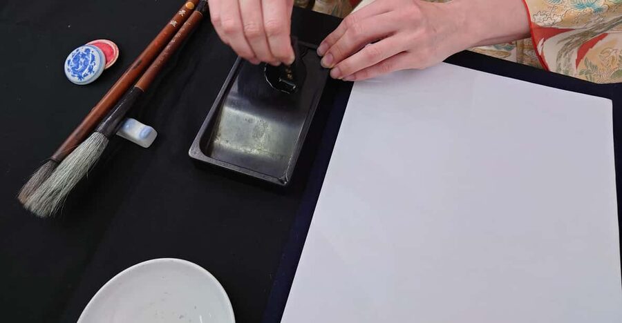 Kyoto: Sumi Ink and Brush Calligraphy Experience - Grinding sumi ink gives the class its quiet center